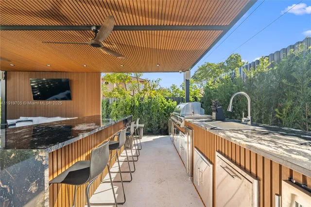 a view of a building with a potted plant on the street