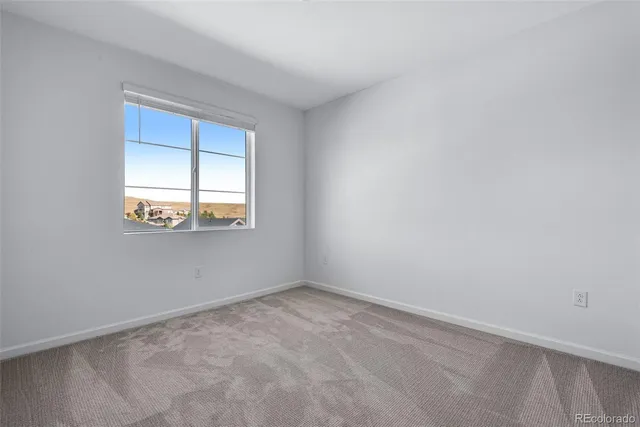 an empty room with closet area