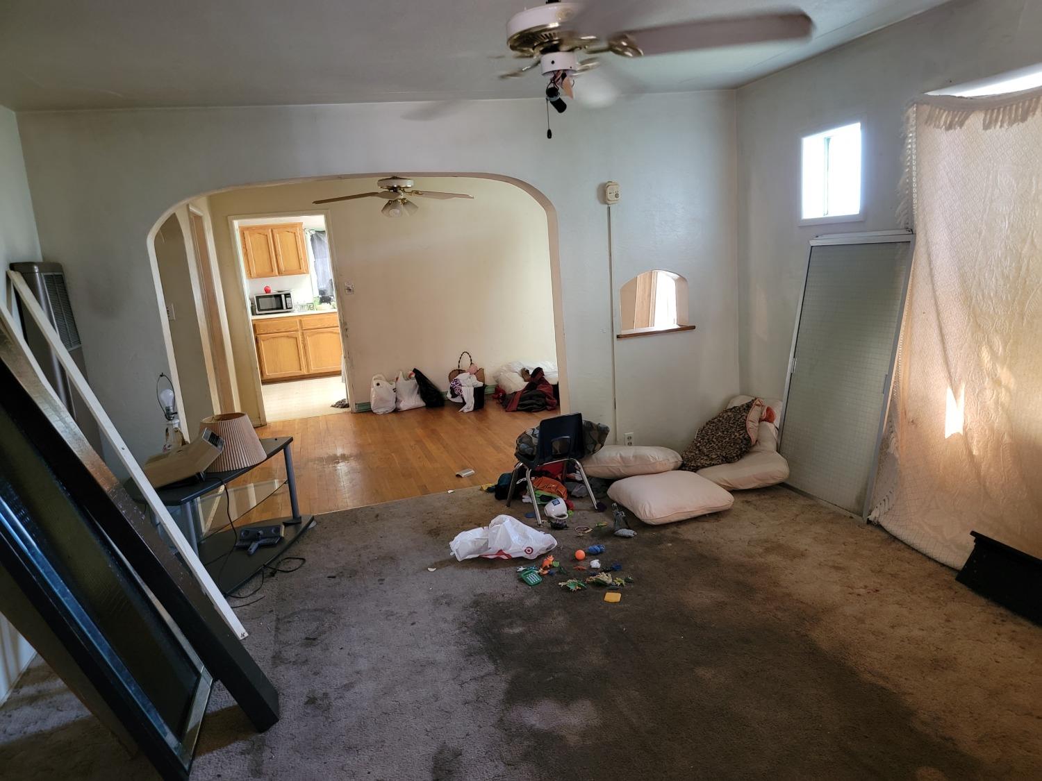1024 E Street Reedley, CA 93654 - Photo 13 of 20 a room with furniture and a window