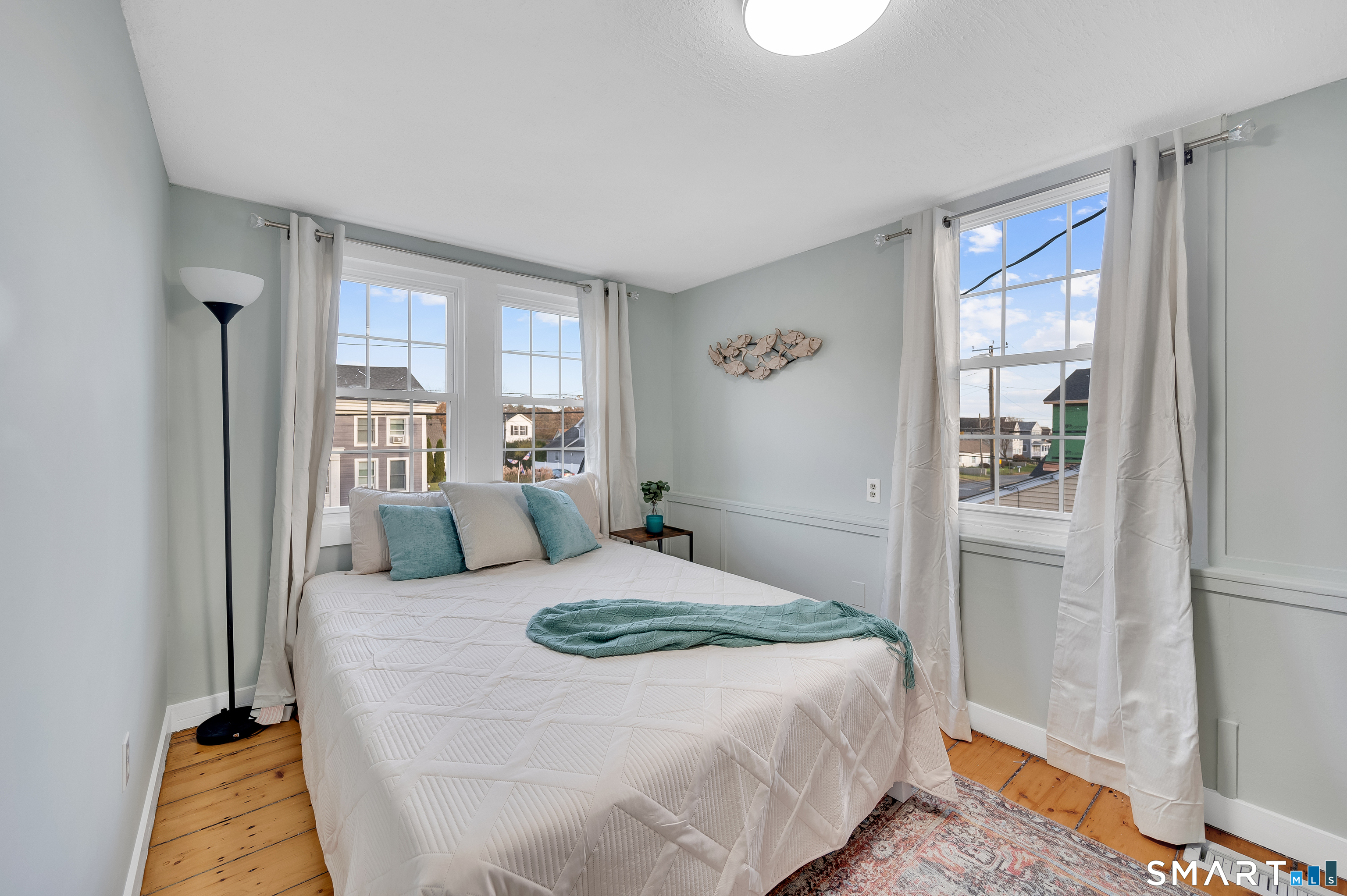 109 Salt Island Road Westbrook, CT 06498 - Photo 13 of 29 a bedroom with a large bed and a window