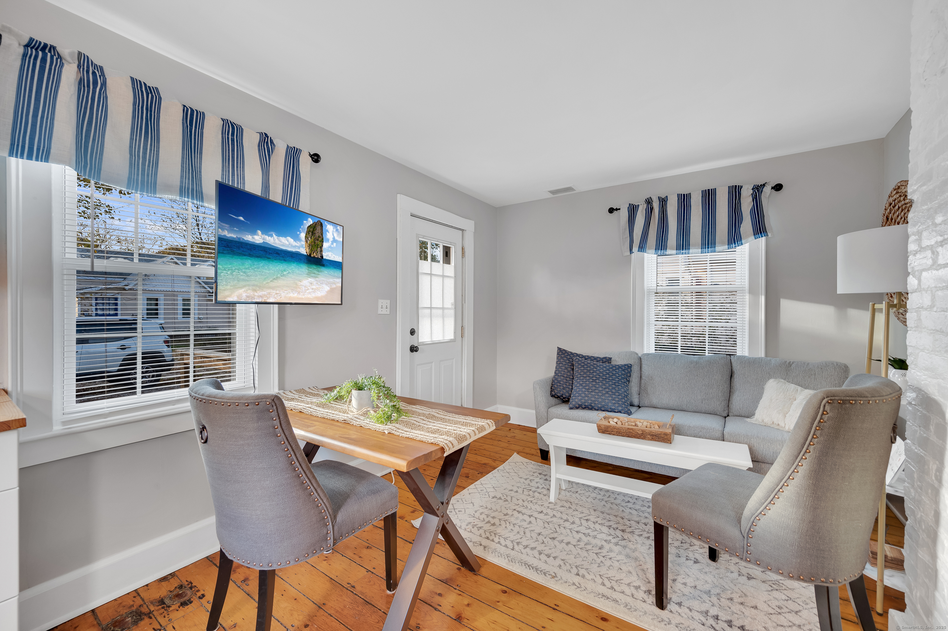 109 Salt Island Road Westbrook, CT 06498 - Photo 20 of 29 a living room with furniture and a table