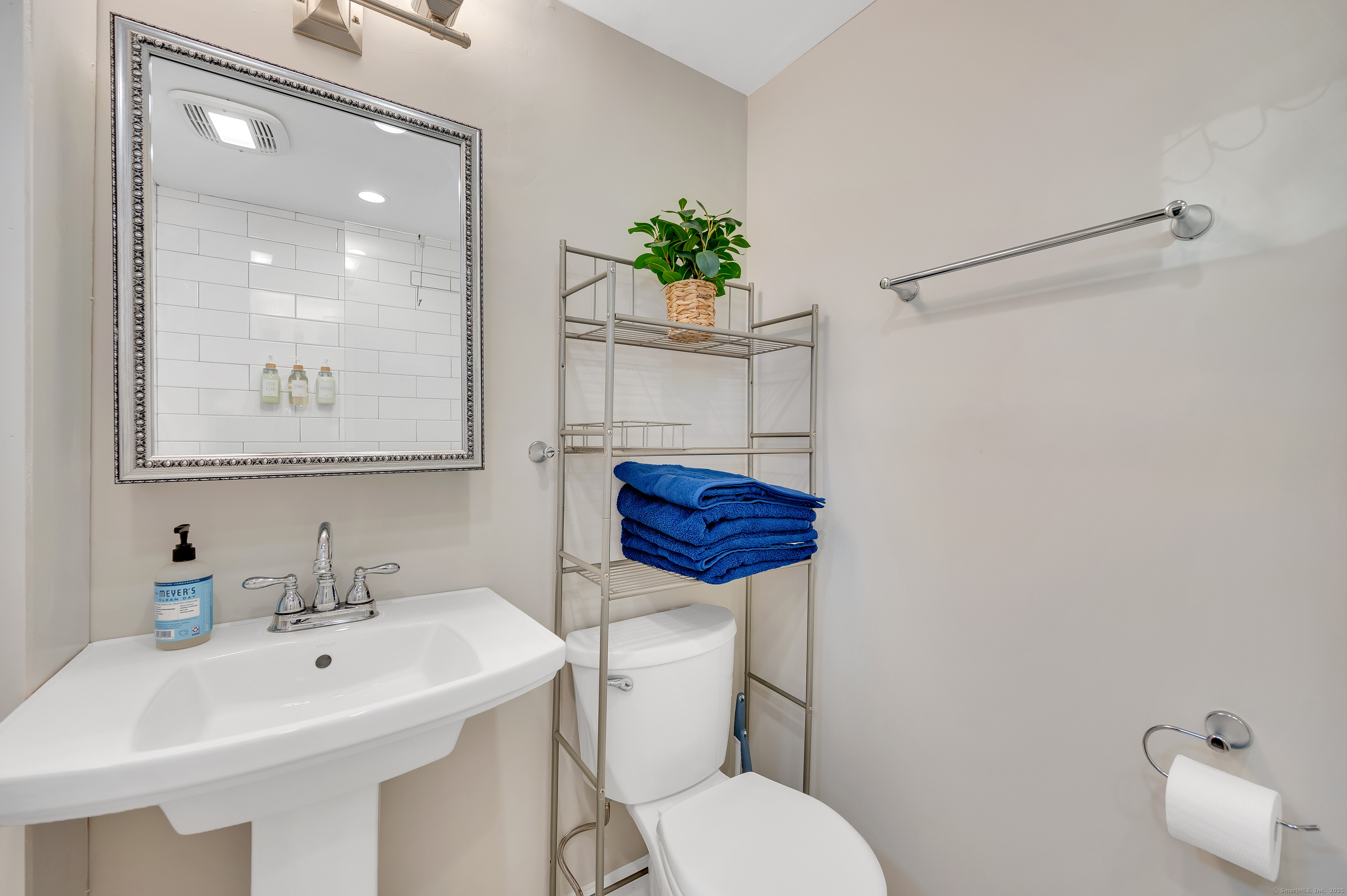 109 Salt Island Road Westbrook, CT 06498 - Photo 24 of 29 a bathroom with a sink a toilet and mirror