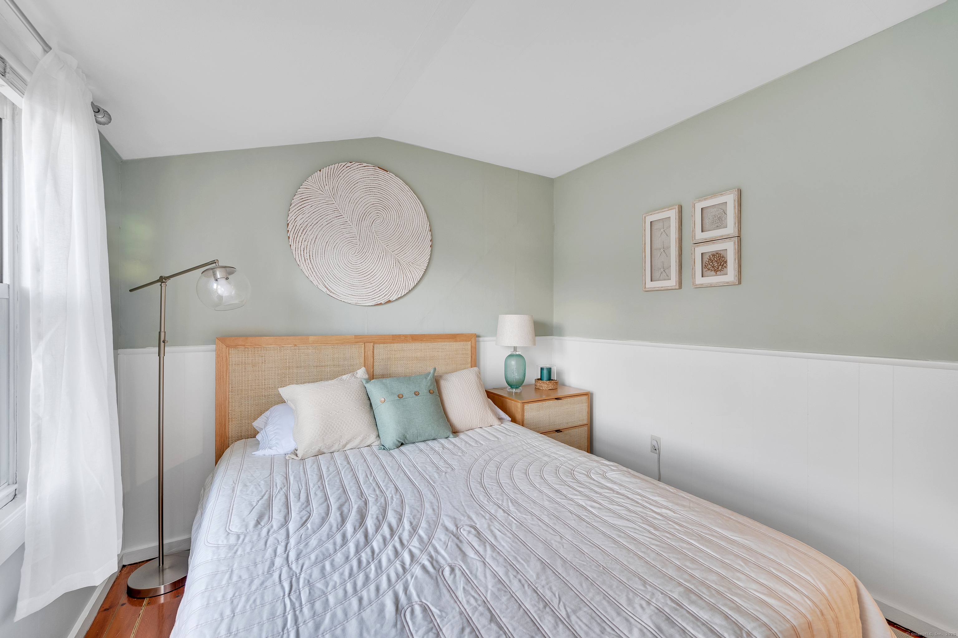 109 Salt Island Road Westbrook, CT 06498 - Photo 25 of 29 a bedroom with a bed and wooden floor