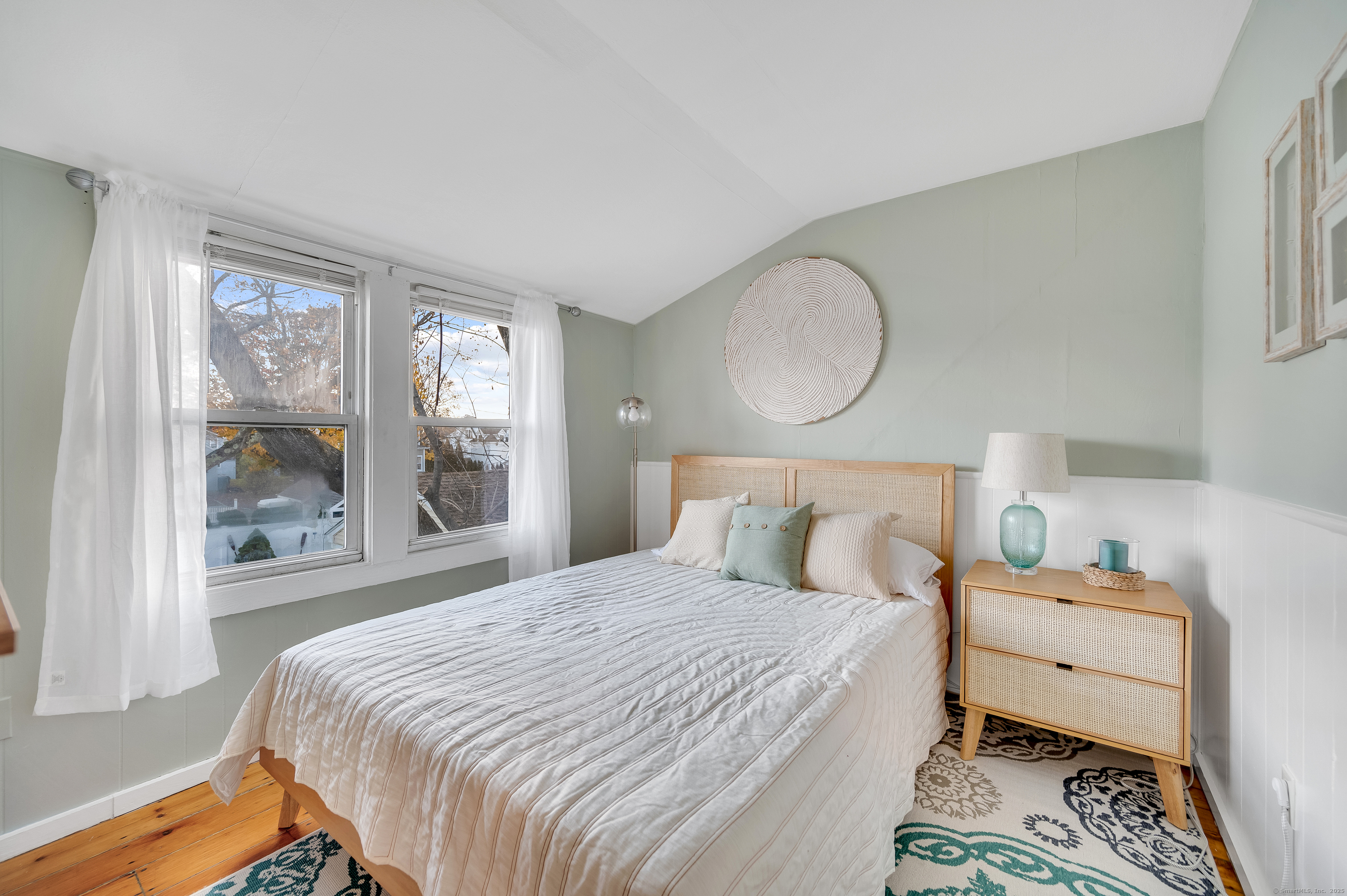 109 Salt Island Road Westbrook, CT 06498 - Photo 27 of 29 a bedroom with a bed and wooden floor