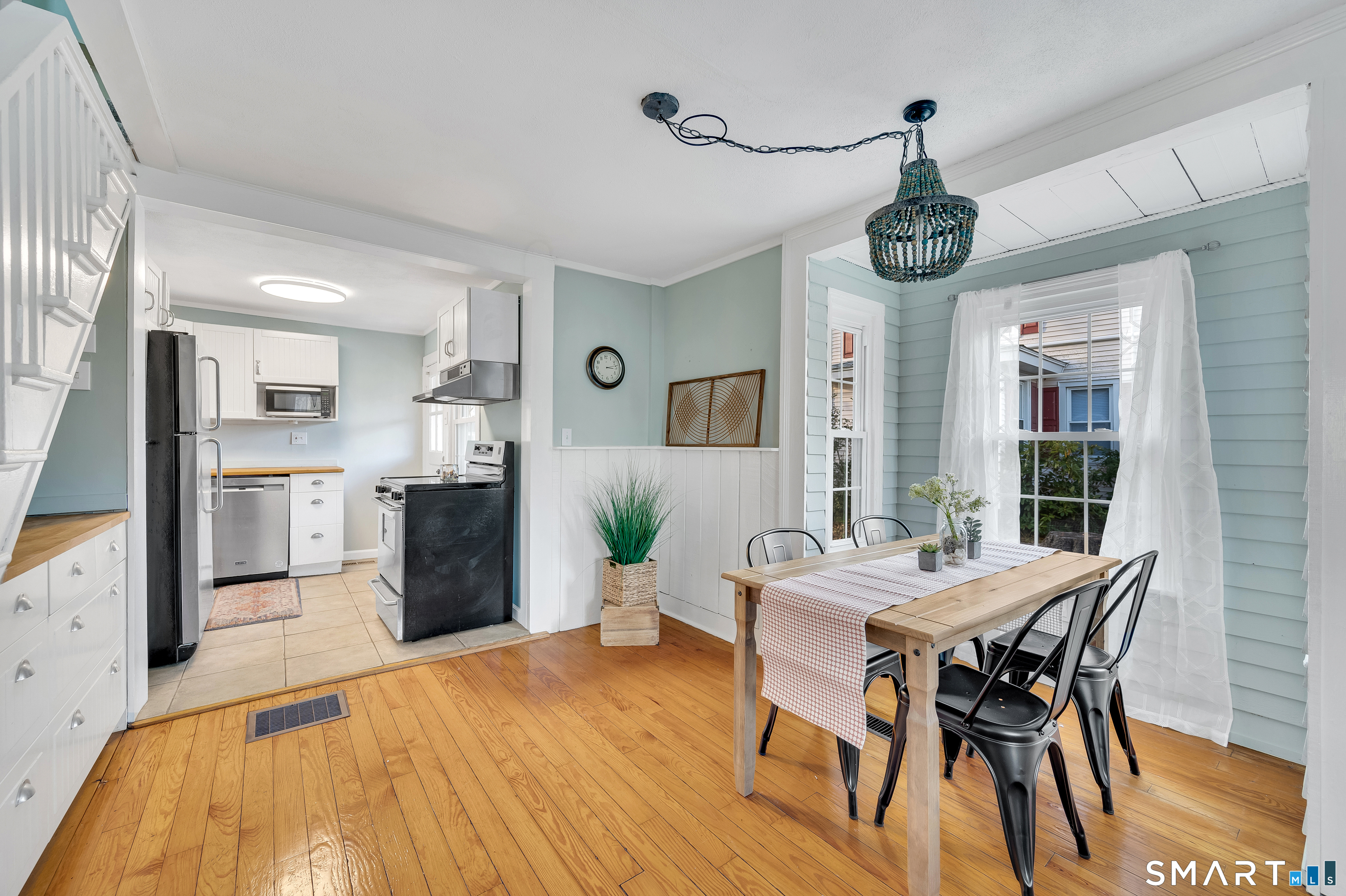 109 Salt Island Road Westbrook, CT 06498 - Photo 5 of 29 a view of a dining room with furniture window and wooden floor
