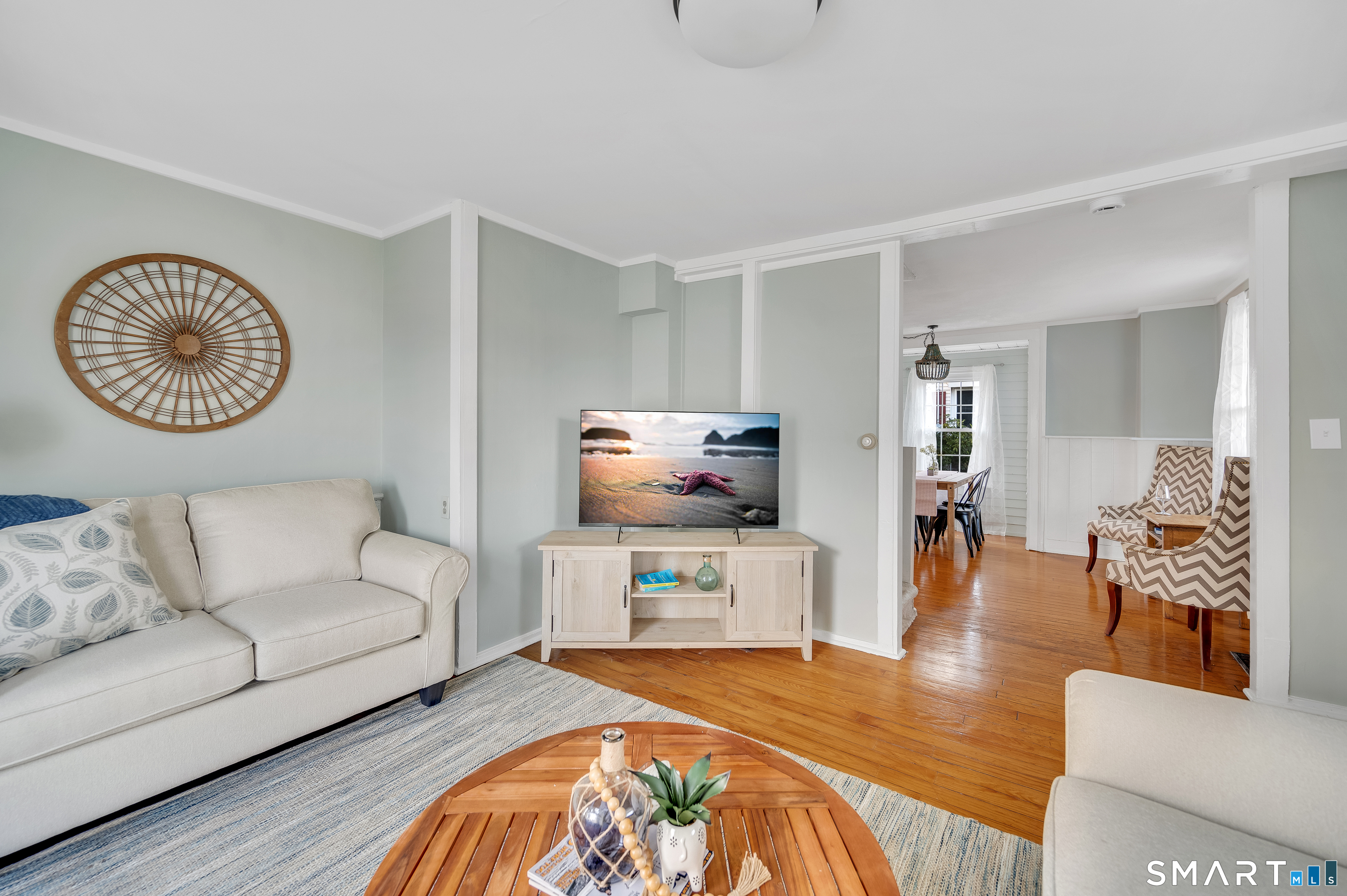 109 Salt Island Road Westbrook, CT 06498 - Photo 6 of 29 a living room with furniture and a wooden floor