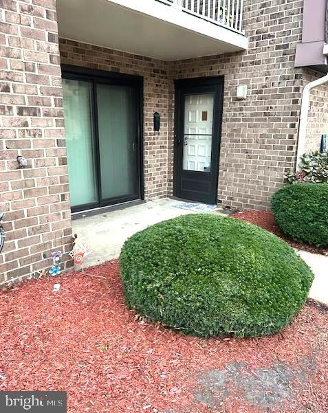 1101 Delaire Landing Road, Unit 101 Philadelphia, PA 19114 - Photo 1 of 29 Inviting entrance with lush greenery.