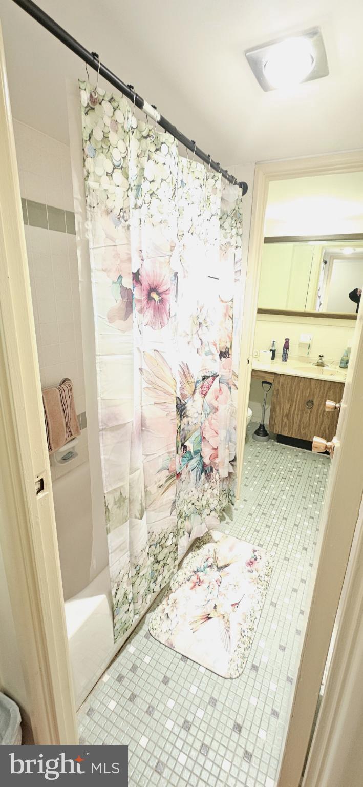 1101 Delaire Landing Road, Unit 101 Philadelphia, PA 19114 - Photo 17 of 29 Charming bathroom with floral accents.