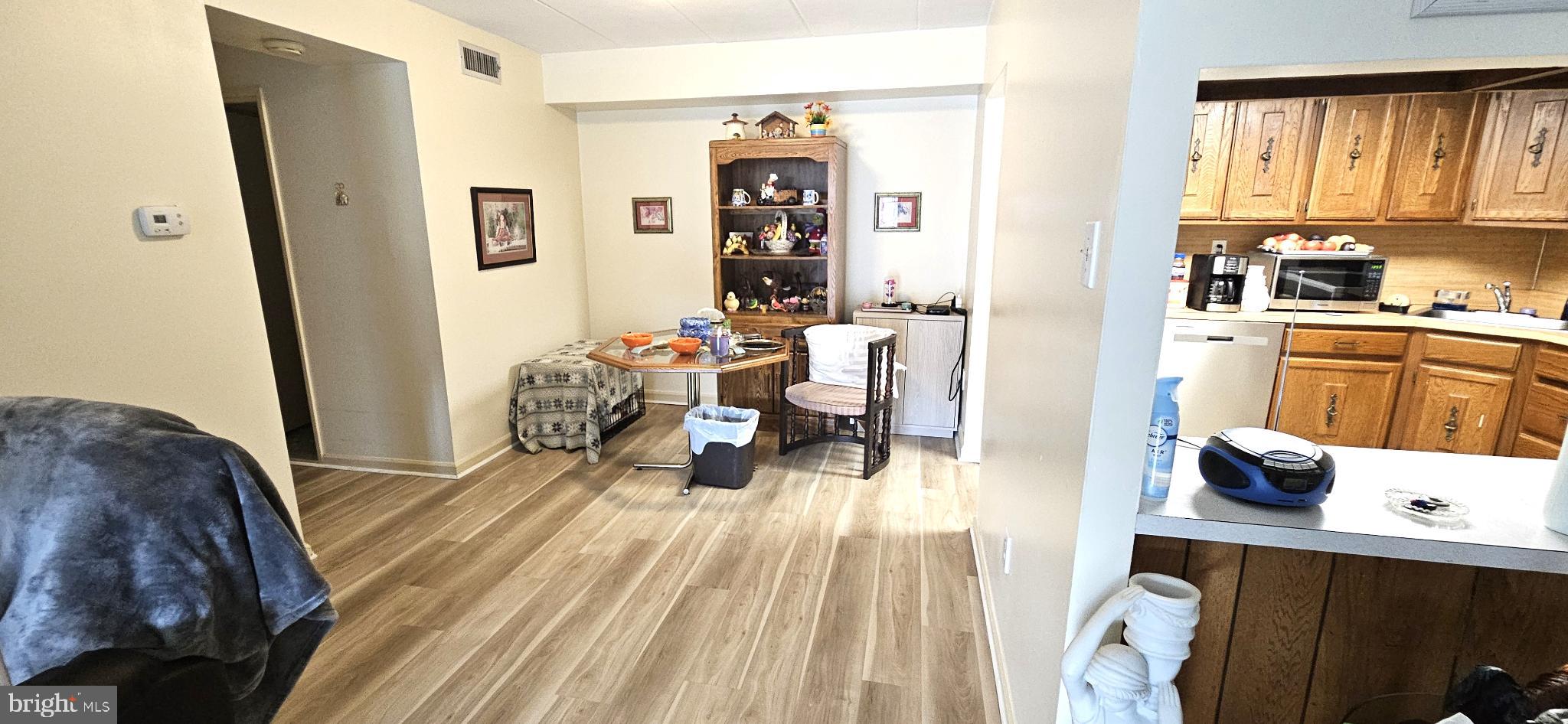 1101 Delaire Landing Road, Unit 101 Philadelphia, PA 19114 - Photo 2 of 29 Inviting open space with warm tones.