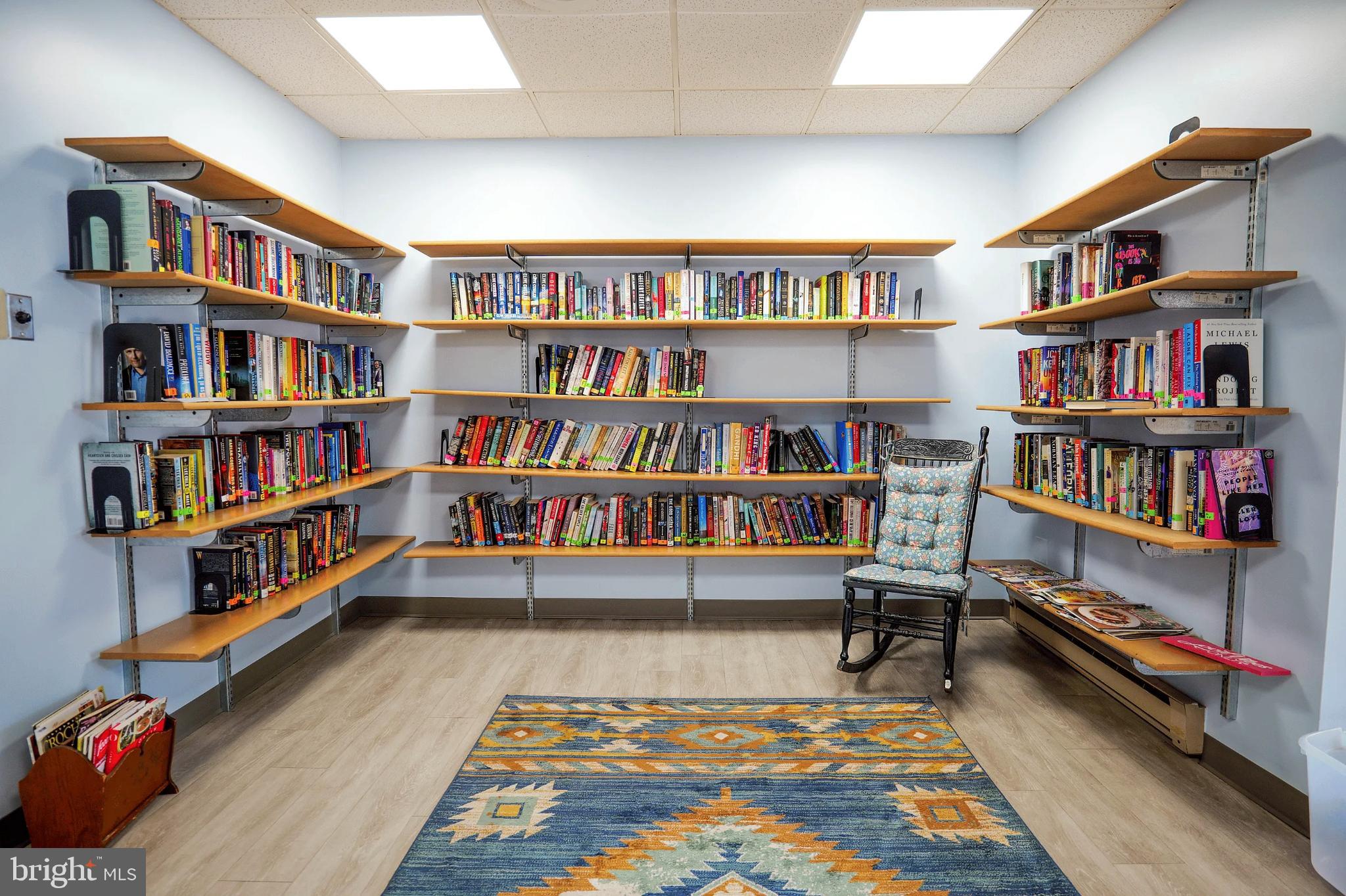 1101 Delaire Landing Road, Unit 101 Philadelphia, PA 19114 - Photo 24 of 29 Cozy reading nook with vibrant bookshelves.