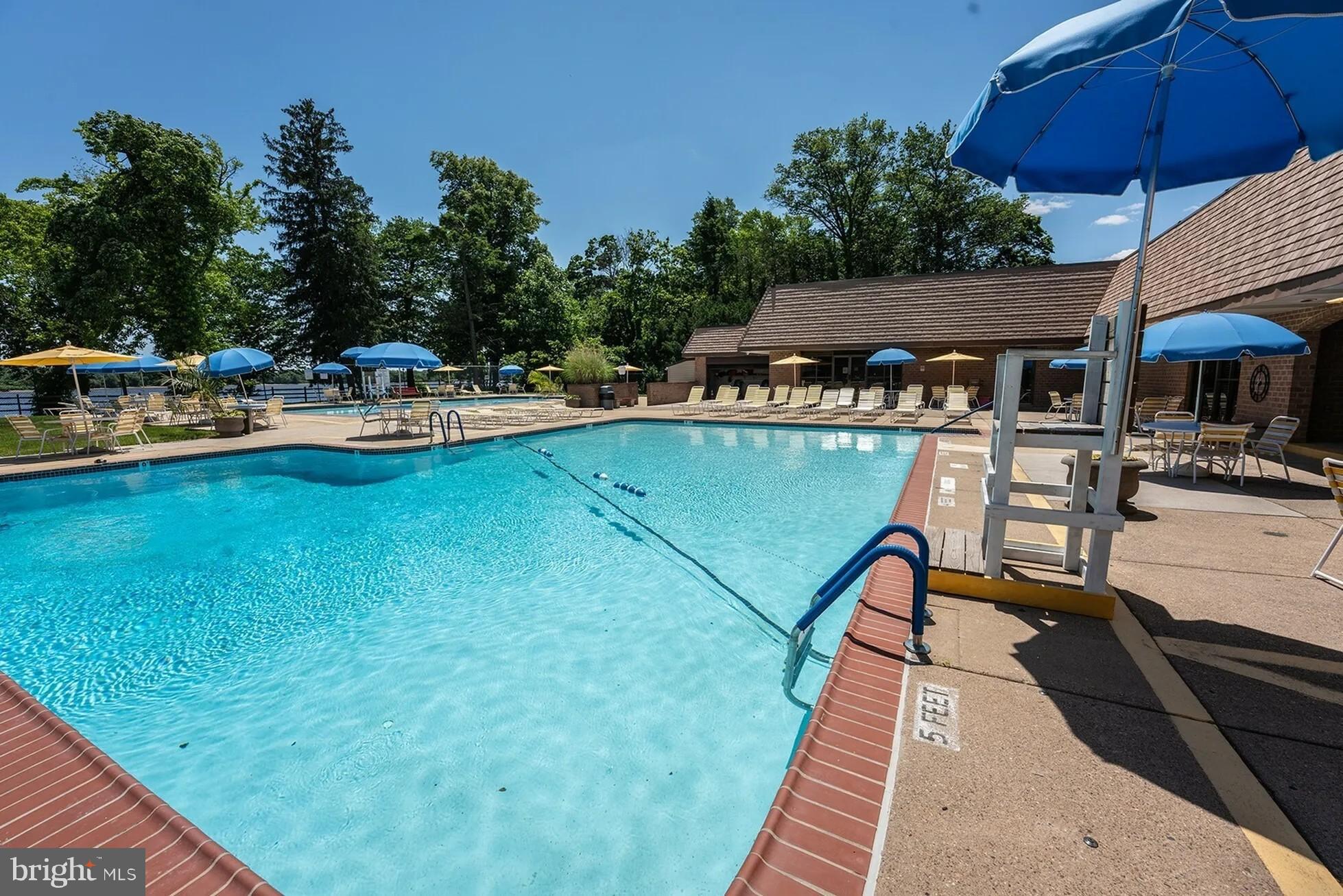 1101 Delaire Landing Road, Unit 101 Philadelphia, PA 19114 - Photo 28 of 29 Sunny oasis with a sparkling pool retreat.