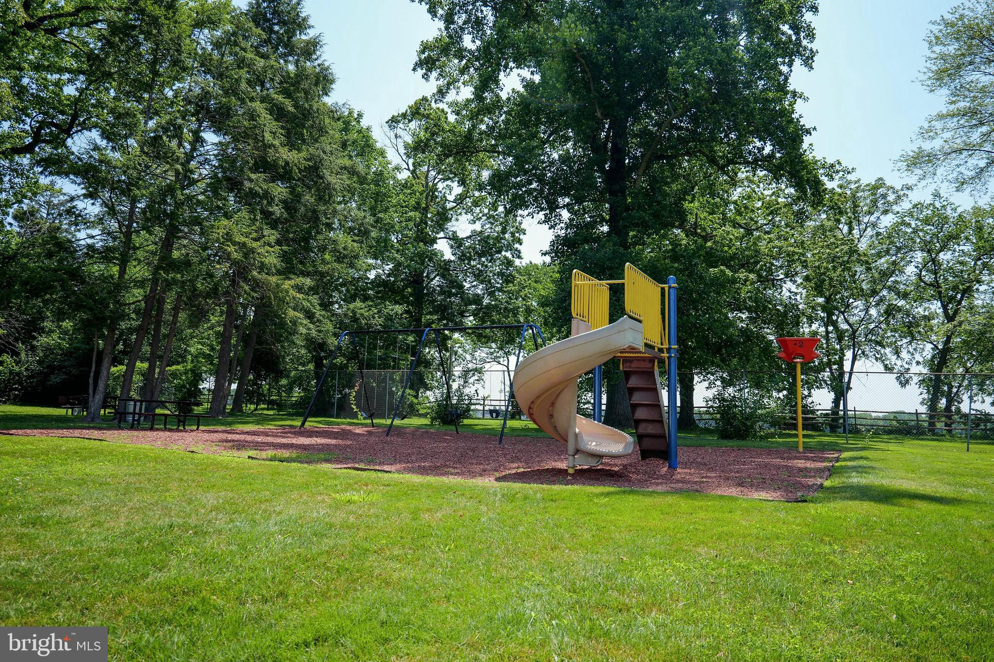 1101 Delaire Landing Road, Unit 101 Philadelphia, PA 19114 - Photo 29 of 29 Sunny playground with slide and swings.