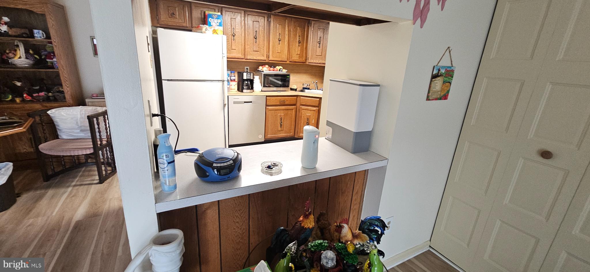 1101 Delaire Landing Road, Unit 101 Philadelphia, PA 19114 - Photo 7 of 29 Cozy kitchen with warm wooden accents.