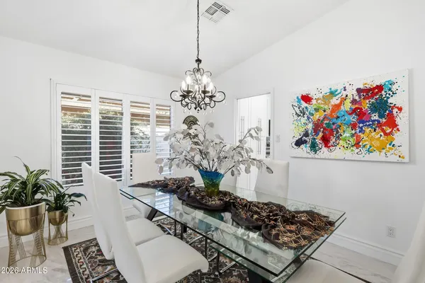 a kitchen with stainless steel appliances kitchen island granite countertop a granite counter top and refrigerator