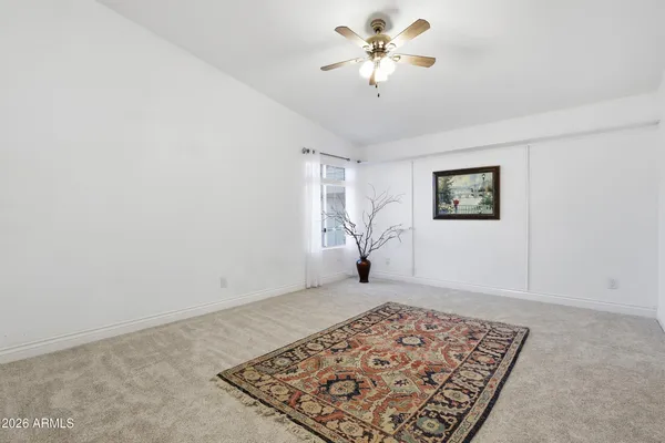 a bedroom with furniture and a window