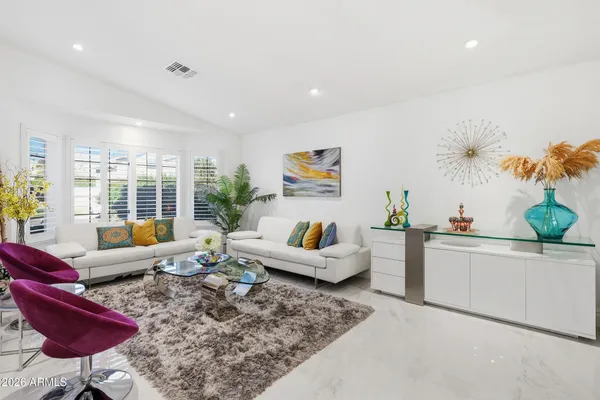 a living room with furniture and a large window