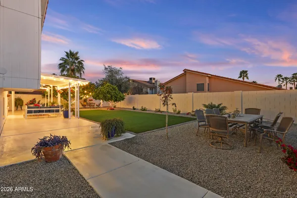 an aerial view of a house with a mountain