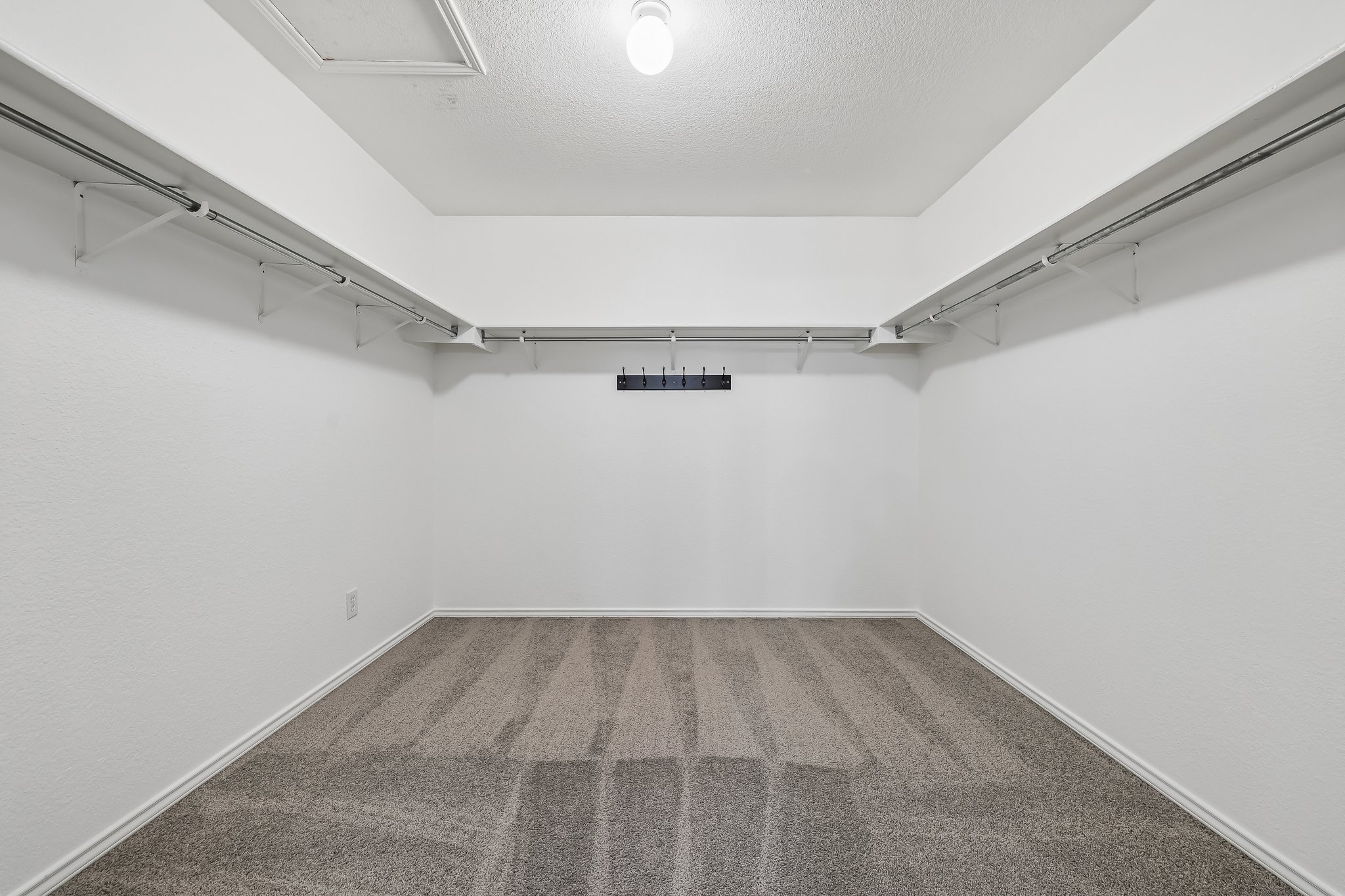 7658 Marble Ridge Drive Austin, TX 78747 - Photo 21 of 34 a view of a room with racks on the wall
