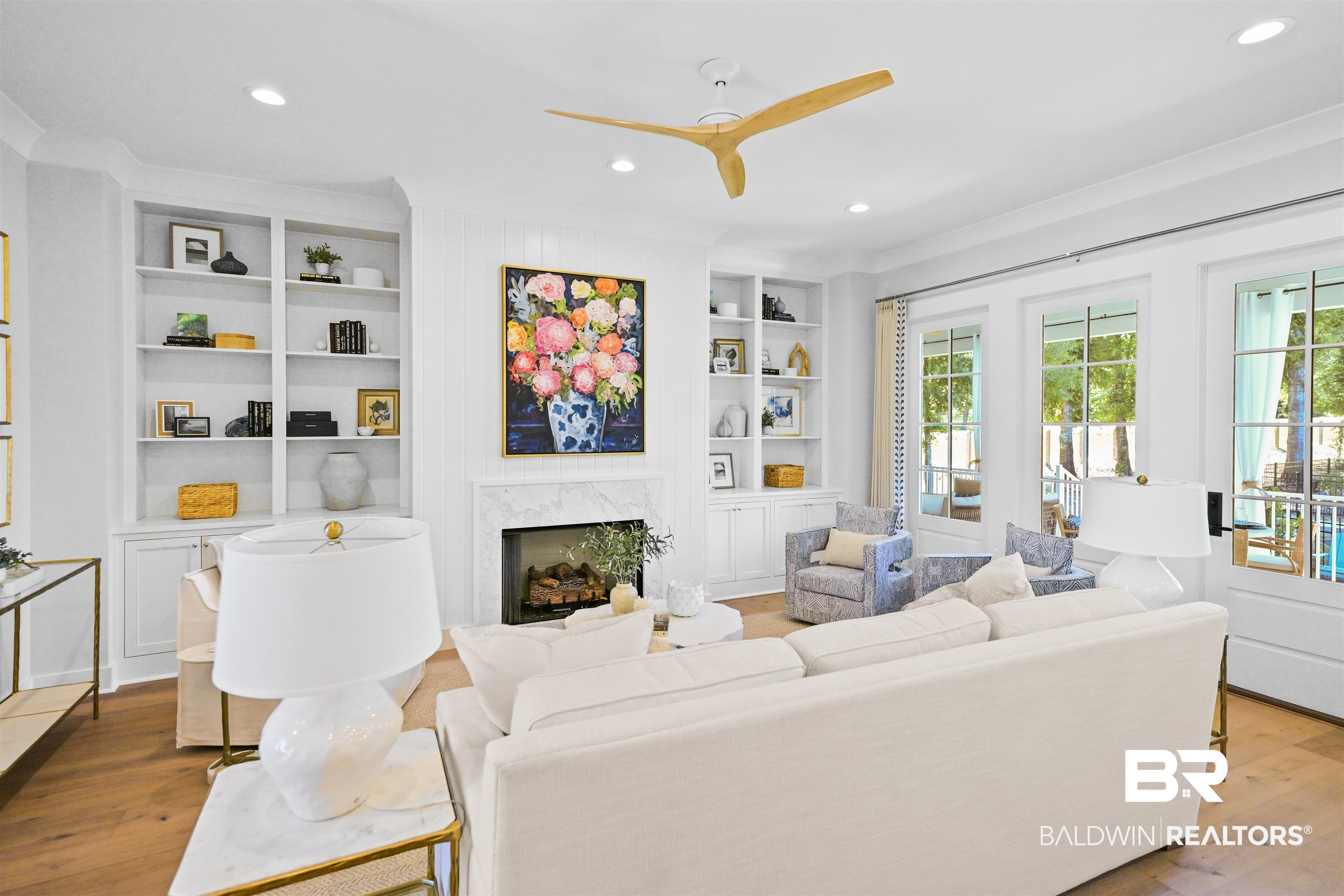 156 Hyacinth Street Fairhope, AL 36532 - Photo 4 of 61 Living room with wood finished floors, recessed lighting, a high end fireplace, ceiling fan, and built in features