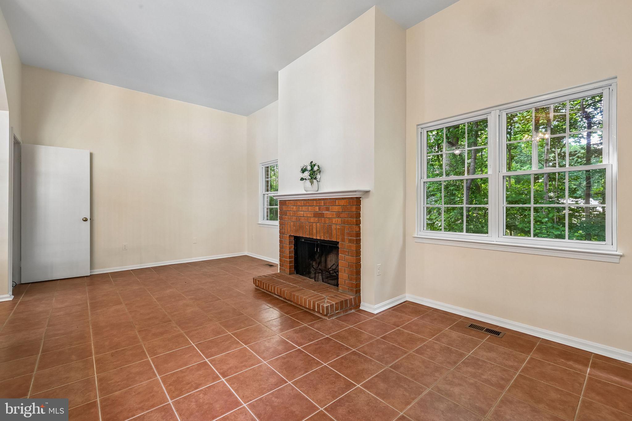 11714 Dry River Court Reston, VA 20191 - Photo 5 of 24 a view of a livingroom with a fireplace and window