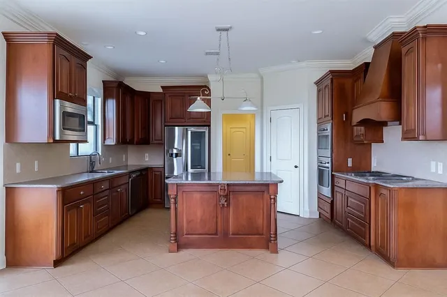 a living room with furniture a large window and a fireplace