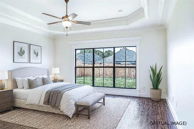 a view of a big room with wooden floor and windows