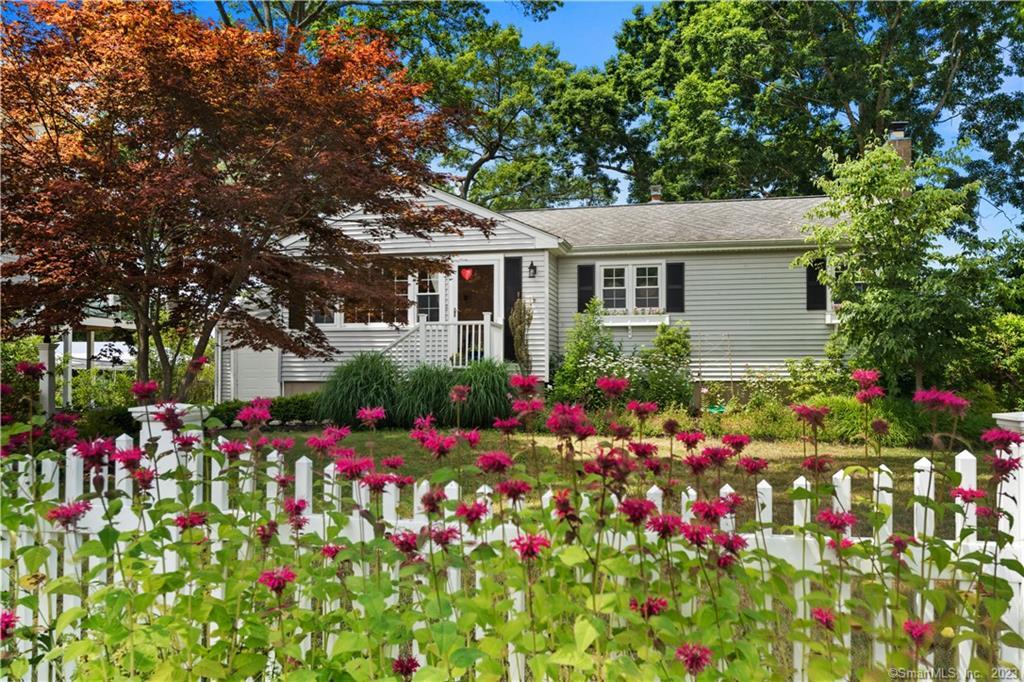 131 Beach Park Road Clinton, CT 06413 - Photo 1 of 1 a view of a potted flower in a garden in front of house