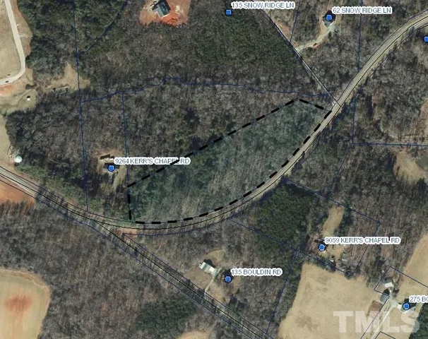 a aerial view of a house with a yard