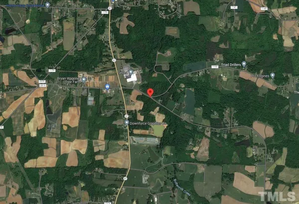 a view of a yard with a street view