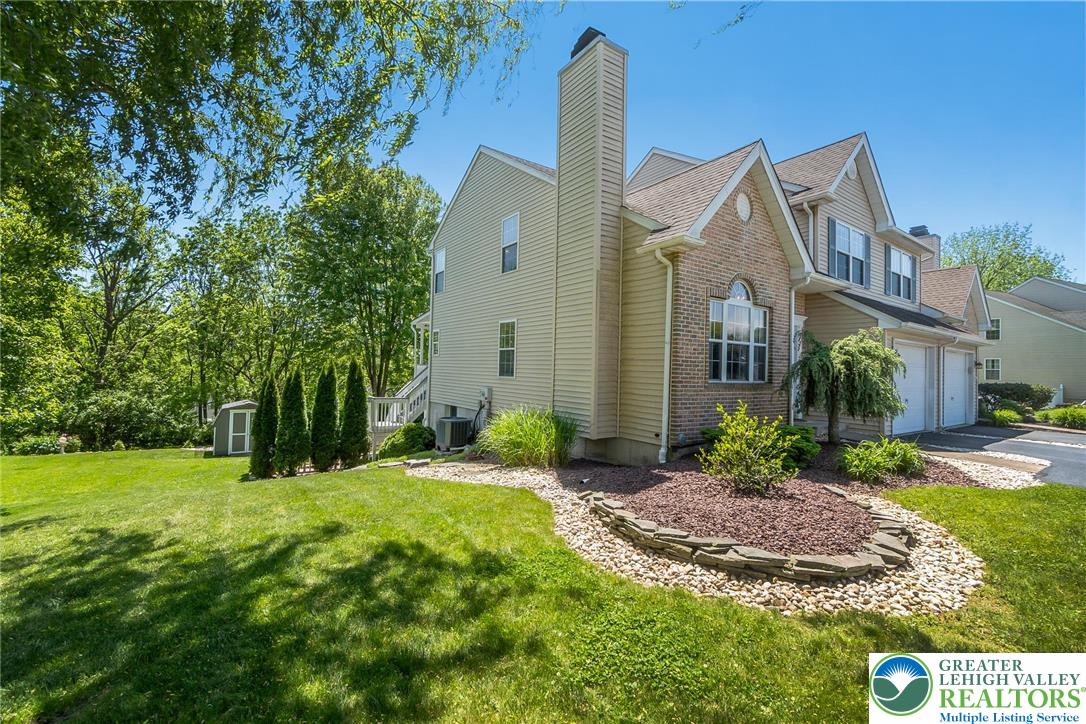 2314 Red Maple Drive Coplay, PA 18037 - Photo 68 of 73 A classic two-story home with a brick and siding exterior and an inviting well-maintained yard.
