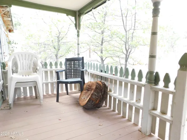 a view of balcony with wooden floor