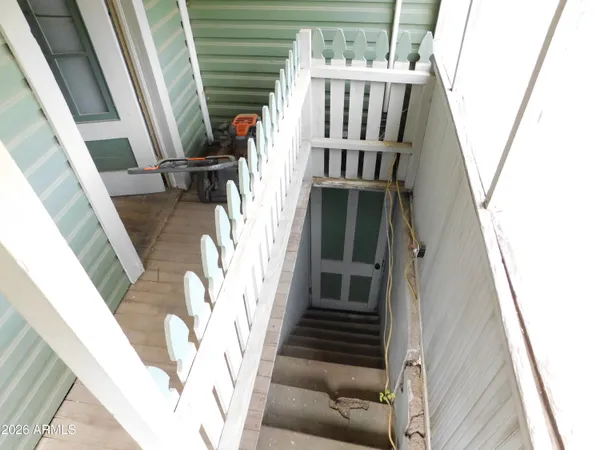 a room with pool table and windows
