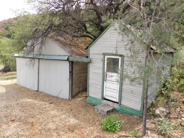 a wooden bench sitting in the middle of a field