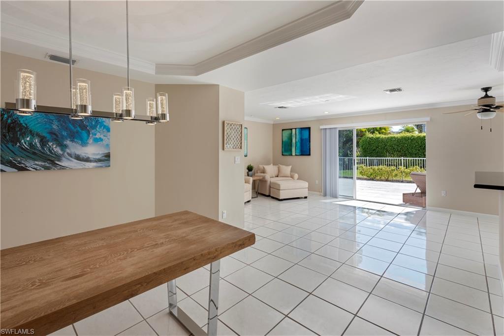 502 Whispering Pine Lane Naples, FL 34103 - Photo 7 of 11 a view of kitchen and living room