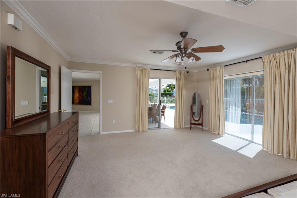502 Whispering Pine Lane Naples, FL 34103 - Photo 8 of 11 a view of a livingroom with a flat screen tv