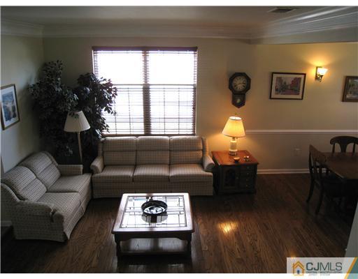 33 Brownstone Road East Windsor, NJ 08520 - Photo 2 of 20 a living room with furniture and a large window