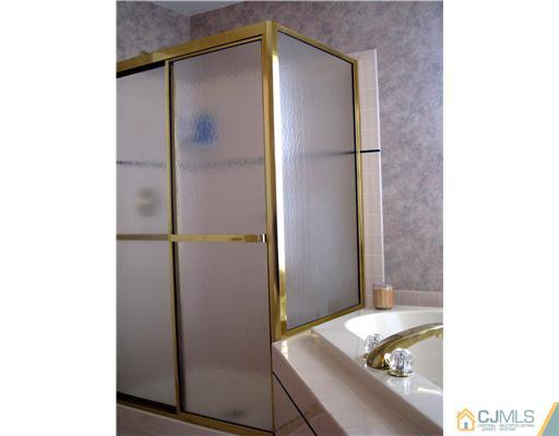 33 Brownstone Road East Windsor, NJ 08520 - Photo 13 of 20 a bathroom with a tub and shower