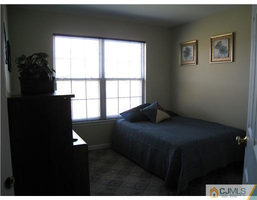 33 Brownstone Road East Windsor, NJ 08520 - Photo 15 of 20 a bedroom with a bed and a window