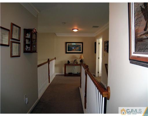 33 Brownstone Road East Windsor, NJ 08520 - Photo 17 of 20 a view of a hallway with workspace and windows