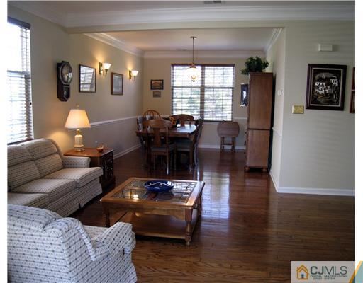 33 Brownstone Road East Windsor, NJ 08520 - Photo 3 of 20 a living room with furniture and wooden floor