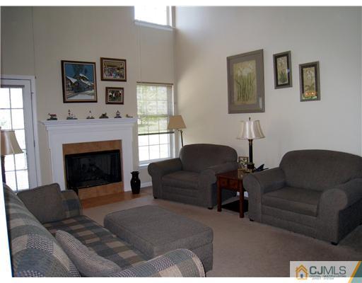 33 Brownstone Road East Windsor, NJ 08520 - Photo 6 of 20 a living room with furniture and a fireplace