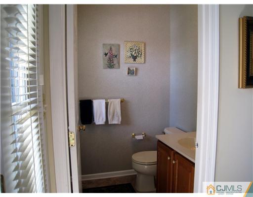 33 Brownstone Road East Windsor, NJ 08520 - Photo 8 of 20 a bathroom with a toilet and a shower curtain
