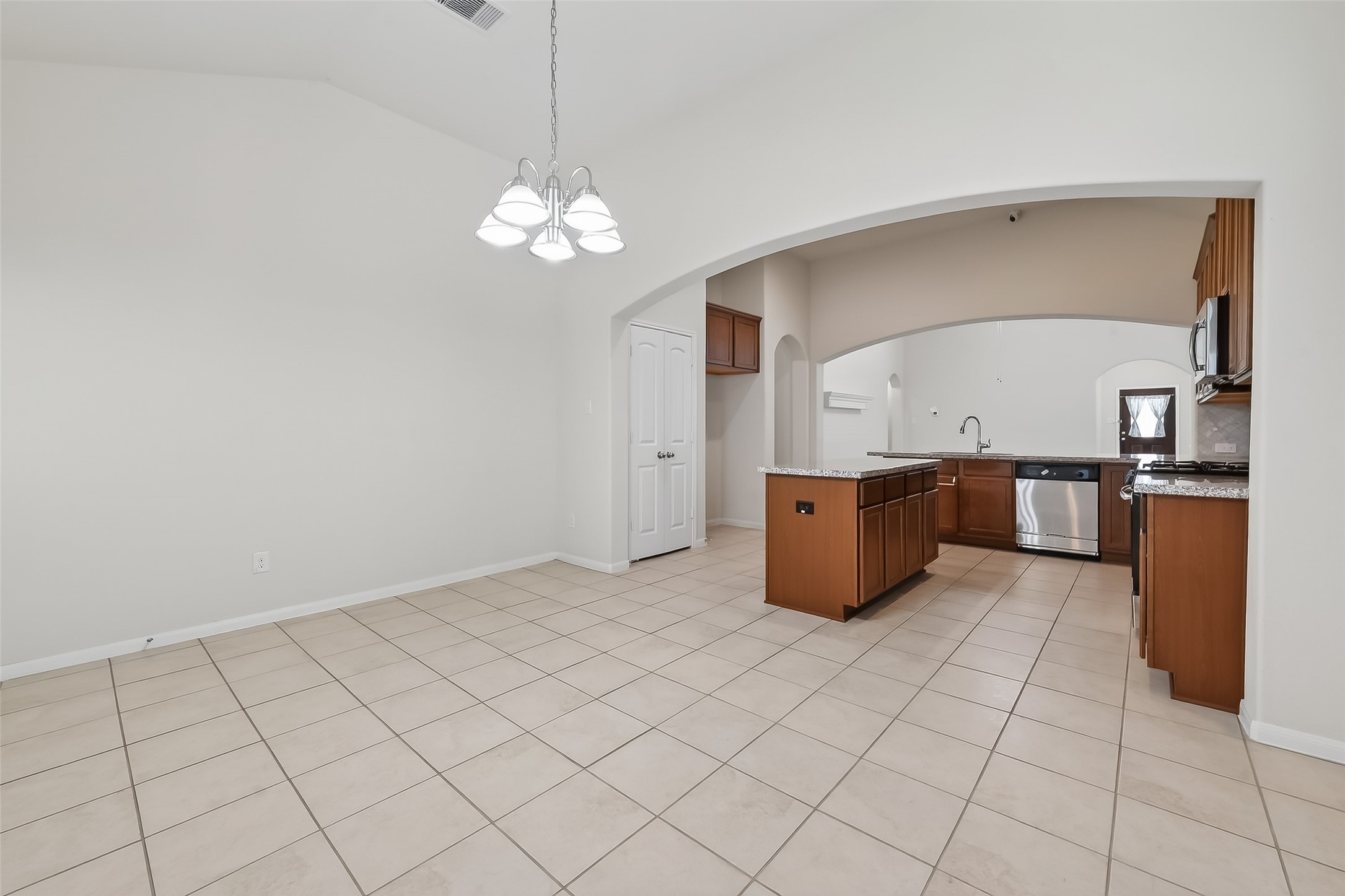 7631 Granite Terrace Lane Houston, TX 77083 - Photo 11 of 46 a kitchen with stainless steel appliances granite countertop a sink and cabinets