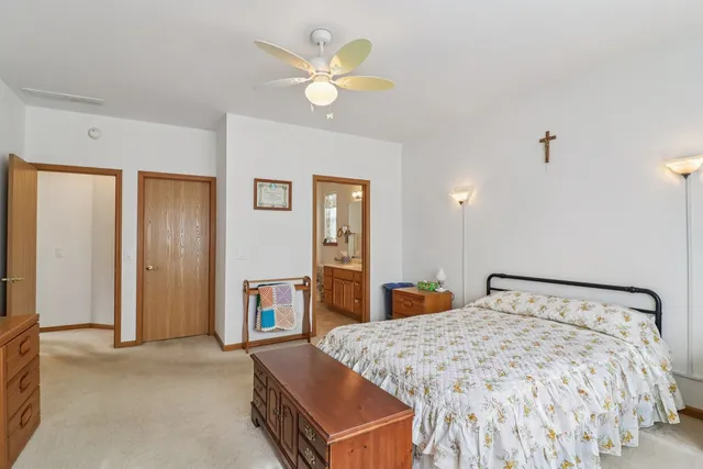 a bedroom with a bed and a dresser