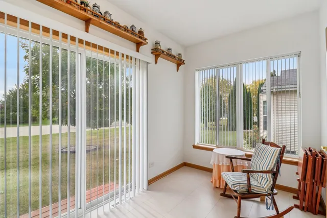 a view of a balcony with furniture and outside view