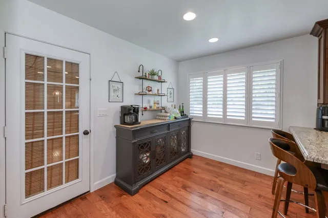 a view of house with a garden and pathway