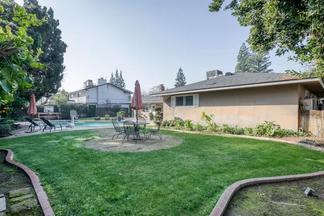 a bathroom with a granite countertop sink mirror and shower