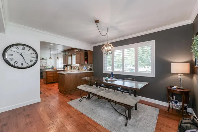 a kitchen with stainless steel appliances granite countertop a stove and a refrigerator