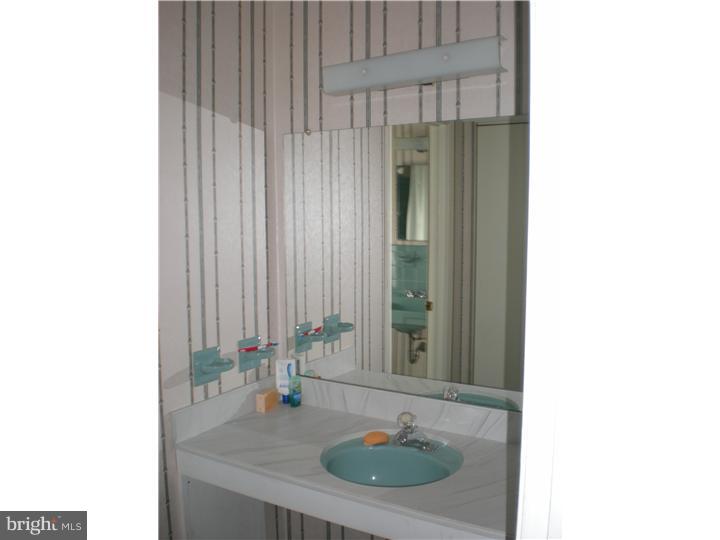 4 Ramsgate Road Cherry Hill, NJ 08003 - Photo 17 of 24 a bathroom with a sink and a mirror