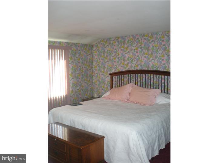 4 Ramsgate Road Cherry Hill, NJ 08003 - Photo 18 of 24 a bedroom with a bed and a window
